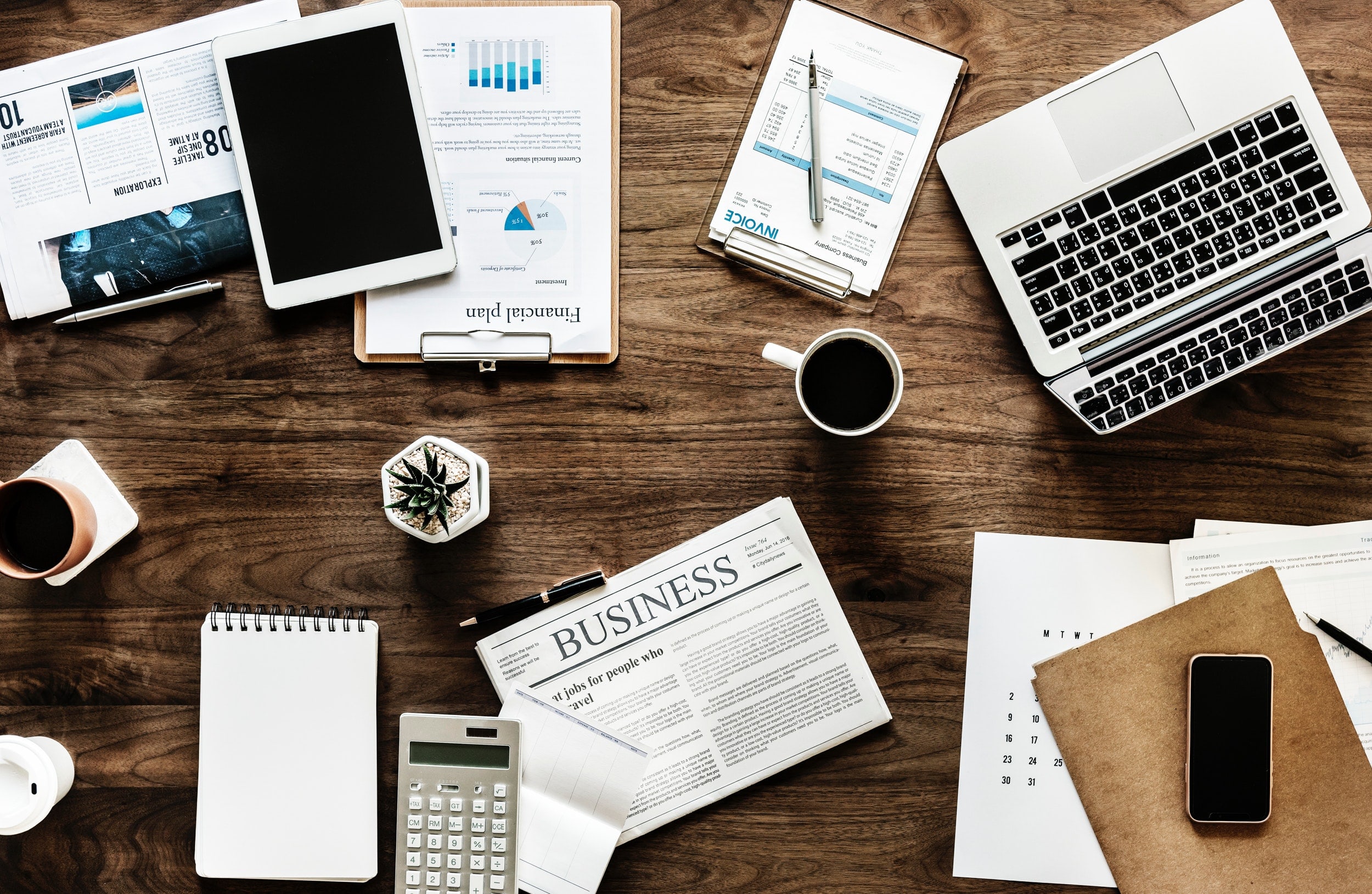 Office materials scattered on the desk