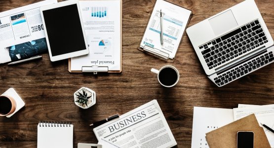 Office materials scattered on the desk